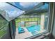 Stunning pool and spa with screened enclosure and lake view at 10813 Rolling Moss Rd, Tampa, FL 33647