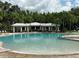 Resort-style community pool with covered seating at 10813 Rolling Moss Rd, Tampa, FL 33647