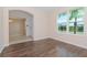 Spacious dining area with wood flooring and natural light at 10813 Rolling Moss Rd, Tampa, FL 33647