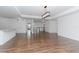 Open dining area with hardwood floors and modern chandelier at 10813 Rolling Moss Rd, Tampa, FL 33647