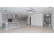 Open concept kitchen with gray cabinets and island at 10813 Rolling Moss Rd, Tampa, FL 33647