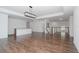 Open dining room with hardwood floors and modern chandelier at 10813 Rolling Moss Rd, Tampa, FL 33647