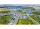 Aerial view showing a neighborhood with houses near lakes and roads at 10813 Rolling Moss Rd, Tampa, FL 33647