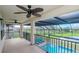 Covered balcony overlooking the pool and lake at 10813 Rolling Moss Rd, Tampa, FL 33647