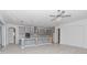 Open concept kitchen with gray cabinets and island at 10813 Rolling Moss Rd, Tampa, FL 33647