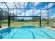 Enclosed pool with a lake view at 10813 Rolling Moss Rd, Tampa, FL 33647