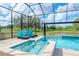Enclosed pool and spa with lake view at 10813 Rolling Moss Rd, Tampa, FL 33647