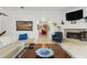 Spacious living room features a fireplace and access to a home theater at 833 Ponce De Leon Dr, Tierra Verde, FL 33715