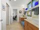 Modern bathroom with double vanity and a built-in bench at 833 Ponce De Leon Dr, Tierra Verde, FL 33715