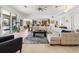Open floor plan living room with sectional sofa and water views at 833 Ponce De Leon Dr, Tierra Verde, FL 33715