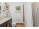 Simple bathroom with shower/tub combo and updated vanity at 833 Ponce De Leon Dr, Tierra Verde, FL 33715