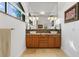 Double vanity bathroom with stylish tile and ample storage at 833 Ponce De Leon Dr, Tierra Verde, FL 33715