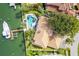 Aerial view of a luxury home with pool and private dock at 833 Ponce De Leon Dr, Tierra Verde, FL 33715