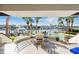 Waterfront patio with seating area and stunning water views at 833 Ponce De Leon Dr, Tierra Verde, FL 33715