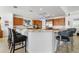 Modern kitchen with large island, stainless steel appliances, and blue pendant lights at 833 Ponce De Leon Dr, Tierra Verde, FL 33715