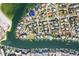 Aerial view of a waterfront community with many houses and boats at 833 Ponce De Leon Dr, Tierra Verde, FL 33715