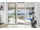 View of patio with water access from sliding glass doors at 833 Ponce De Leon Dr, Tierra Verde, FL 33715