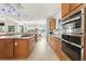 Bright kitchen with stainless steel appliances, granite countertops, and an eat-in area at 833 Ponce De Leon Dr, Tierra Verde, FL 33715