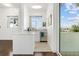 Small galley kitchen with modern appliances and water views at 833 Ponce De Leon Dr, Tierra Verde, FL 33715