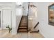 Stunning wooden staircase with decorative accents at 833 Ponce De Leon Dr, Tierra Verde, FL 33715