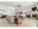 Living area with sectional sofa, fireplace, and wood accents at 833 Ponce De Leon Dr, Tierra Verde, FL 33715