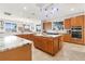 Island kitchen with granite countertops and stainless steel appliances at 833 Ponce De Leon Dr, Tierra Verde, FL 33715