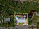 Aerial view of property highlighting its waterfront location and solar panels at 9913 Alavista Dr, Gibsonton, FL 33534