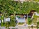 Aerial view of property highlighting its waterfront location and solar panels at 9913 Alavista Dr, Gibsonton, FL 33534