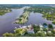 Aerial view of property highlighting its waterfront position at 9913 Alavista Dr, Gibsonton, FL 33534