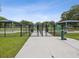 Dog park with fenced area, water fountain, and shaded seating at 9913 Alavista Dr, Gibsonton, FL 33534