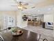 Open dining area with wood table and view into the kitchen at 9913 Alavista Dr, Gibsonton, FL 33534