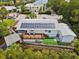 Aerial view of house with solar panels and waterfront access at 9913 Alavista Dr, Gibsonton, FL 33534