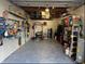 Organized garage with overhead storage and gym equipment at 9913 Alavista Dr, Gibsonton, FL 33534