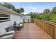 Deck with two lounge chairs and tranquil surroundings at 9913 Alavista Dr, Gibsonton, FL 33534