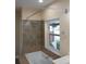 Bathroom with soaking tub and shower at 9913 Alavista Dr, Gibsonton, FL 33534