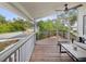 Relaxing screened porch with wooden deck and water view at 9913 Alavista Dr, Gibsonton, FL 33534