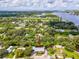 Aerial view showing home's waterfront location and surrounding landscape at 9913 Alavista Dr, Gibsonton, FL 33534