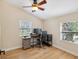 Functional home office featuring a desk, chair, and ample natural light at 9913 Alavista Dr, Gibsonton, FL 33534