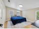 Spacious bedroom with a king-size bed and ample natural light at 9913 Alavista Dr, Gibsonton, FL 33534