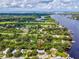 Aerial view showing home's waterfront location and surrounding landscape at 9913 Alavista Dr, Gibsonton, FL 33534