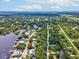 Wide aerial view showcasing the home's surroundings and waterfront access at 9913 Alavista Dr, Gibsonton, FL 33534