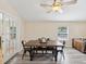 Modern dining room with a large square table and metal chairs at 9913 Alavista Dr, Gibsonton, FL 33534