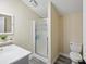 Clean bathroom with a shower and neutral color palette at 9913 Alavista Dr, Gibsonton, FL 33534