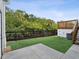 Artificial turf backyard with a deck and canal view at 9913 Alavista Dr, Gibsonton, FL 33534