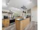 Bright kitchen with stainless steel appliances and a large island at 9913 Alavista Dr, Gibsonton, FL 33534