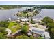 Aerial showing home's location on a waterfront property with private dock and boat access at 9913 Alavista Dr, Gibsonton, FL 33534