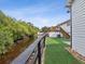 Landscaped backyard, artificial turf, and water views at 9913 Alavista Dr, Gibsonton, FL 33534