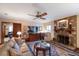 Living room with fireplace, large TV, and comfortable seating at 1506 S Sheridan Forest Dr, Tampa, FL 33629