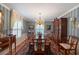 Elegant formal dining room with a large table and china cabinet at 1506 S Sheridan Forest Dr, Tampa, FL 33629