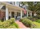 Charming two-story home with a welcoming front porch at 1506 S Sheridan Forest Dr, Tampa, FL 33629